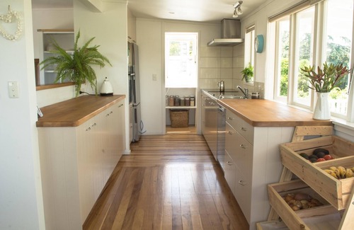 Oneroa House | Oneroa Escape - Oneroa Escape is a beautifully restored 1920s weatherboard home oozing with character and charm and complete with all the modern conveniences expected from a premium Waiheke holiday home. The property is pet-friendly.