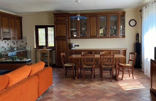 Sanfront House | Panoramic two-story dwelling with private garden, surrounded by green woods.
