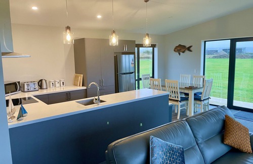 Surat Bay House | Panoramic views of the ocean close enough to the beach to hear the waves.