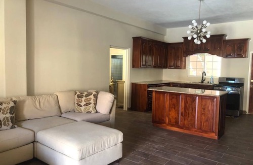 Runaway Bay Bed & Breakfast | Pavillion View Two Bedroom Apartment with En-Suite, Kitchen and Living Room