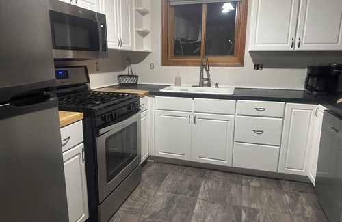 Walloon Lake Cabin | Peaceful cabin hideaway with fire pit & hot tub only 3 blocks from Walloon Lake