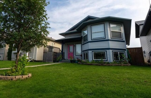 Grande Prairie House | Pink door-ed wonder