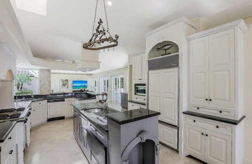 West Naples House | Port Royal residence nestled among Royal Palms