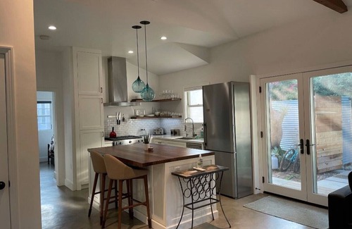 Sunset Park House | Private guesthouse with gated pathway entrance and private yard.
