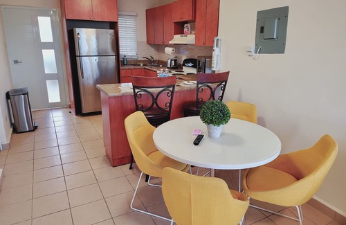 Bucana Apartment | Private Jacuzzi Oasis with Mountain Views. FREE Parking and Laundry