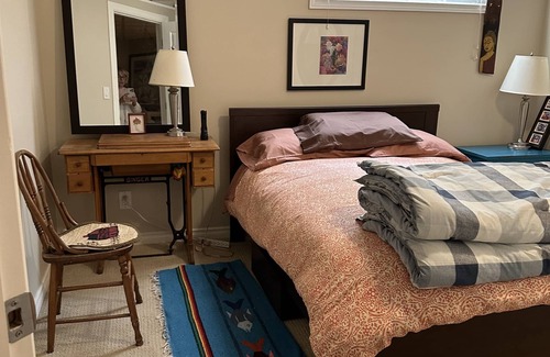 Valley Ridge Bed & Breakfast | Private, quiet, cozy developed basement living area with 2 beds.