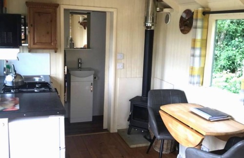 Hadlow Down House | Private, quiet en-suite hut, glorious views to South Downs, wild swimming.