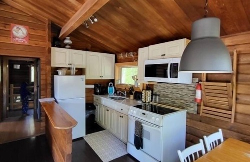 Highlands East Cottage | Quiet Lakefront Getaway - with Hot Tub & Wifi at Waters Edge 160 ft of Shoreline