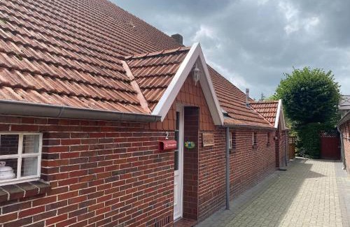 Strackholt Apartment | Reihenhaus in Strackholt mit beheiztem Pool