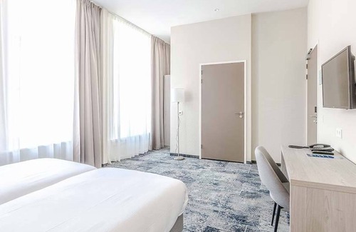 Leeuwarden Hotel | Relax in Historic Luxury with Garden Dining, Near Galleries and Oldehove