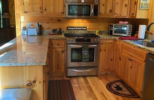 Aska Cabin | Relax on our wrap around porch with a gorgeous view!