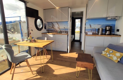 Schleswig Boat Rental | Relaxing vacation on houseboat Hilja with a great view of the Schlei (dog-friendly)