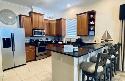 Bahama Beach Condo | Remodeled 3 BR/2BA condo steps to the beach! Sunset views and private garage.