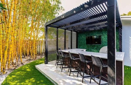 Imperial Point House | Resort Style Backyard Heated Pool Hot Tub Fire Pit