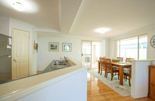 Broadwater House | Retreat on Dolphin - This holiday home includes comfortably appointed, open plan living