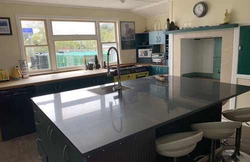 Te Kopuru House | Riverfront Family Home, with spa and stage