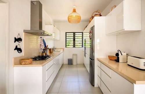 Roches Noires Villa | Rooftop Penthouse, feet in the water
