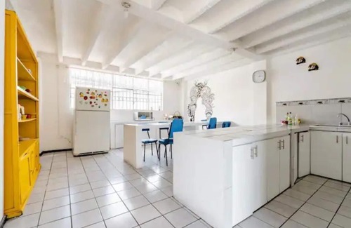 Pasochoa Apartment | Rooms within what was a schooln