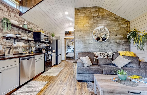 Evergreen House | Rustic getaway with fireplace, patio area, board games, full kitchen, & TV
