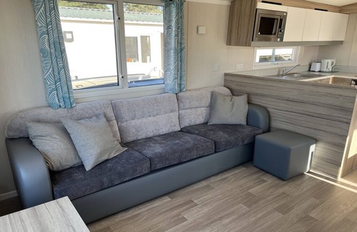 Hamworthy House | Safari Sunset caravan + sea view at Rockley Park, Poole Harbour. Dogs stay free!
