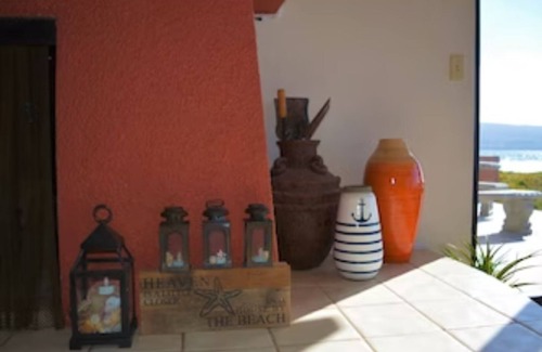 Lengueta Arenosa House | Searenity Keep an eye on kids. You: on patio with a refreshing beverage.