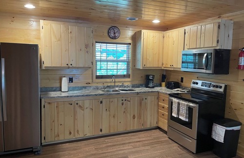 Lejunior Cabin | Secluded Cabin with a mountain view, hot tub, full kitchen, and living room.