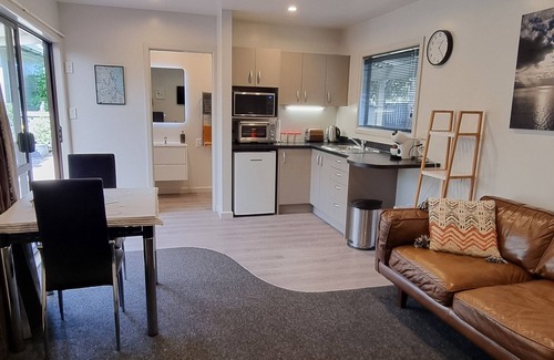 Clive Cottage | Secluded Riverside Cottage set in native garden.