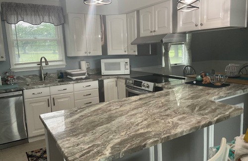 White Marsh Villa | Secluded Waterfront Retreat 2 bed 1 1/2 baths private guest house w Pool & Beach