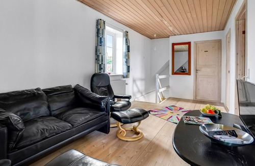 Henne Apartment | Situated right next to the train station, this vacation home near Henne St. awaits you.