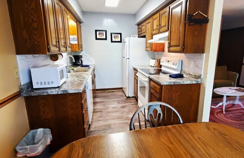Holiday Island Condo | Six-Person Hot Tub, Lakeside, King Beds, Fireplace!