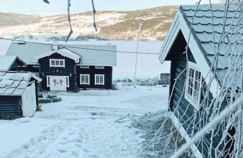 Hundorp Apartment | Sjarmerende tømmerhytte på gårdstun