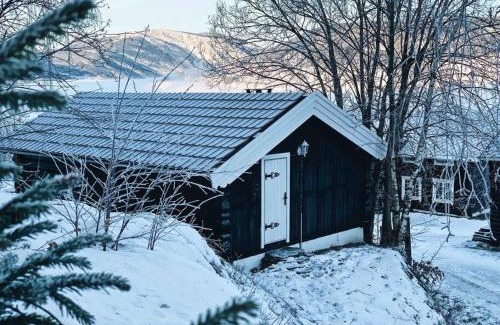 Hundorp Apartment | Sjarmerende tømmerhytte på gårdstun