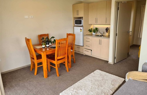 Awhitu Apartment | Sky tower and Water view over looking Paddock