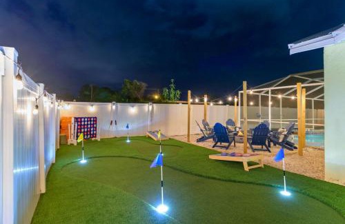 Palma Sola House | Sleeps 16 Heated Pool Hot Tub Fire Pit Putt Putt
