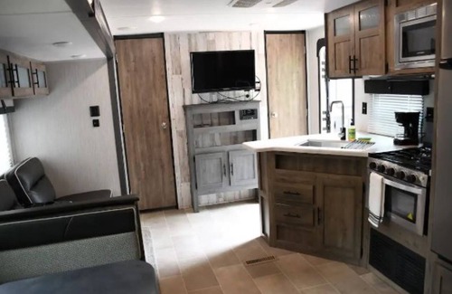 Chatham House | Spacious camper, with private bedrooms. Minutes from Caney and Chatham Lakes