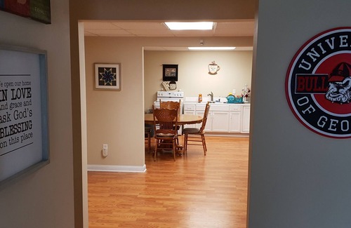 Athens House | Spacious suite with fenced back yard, deck, gas grill, fireplaces and splash pad