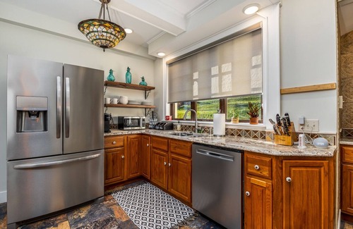 Dubuque House | Spanish Revival 1920 Home in Quiet Neighborhood