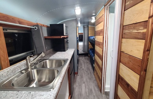 Eddyville House | Stationary renovated local school bus. Inquire about our hunter specials!