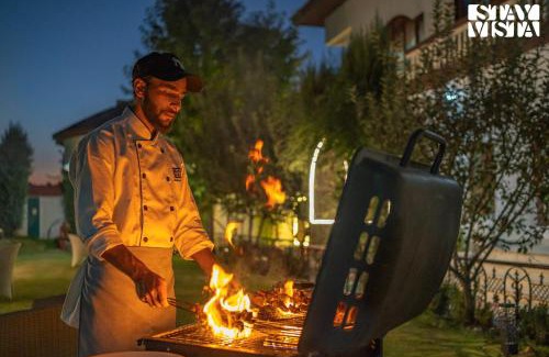 Brein Villa | StayVista at Wooden Arches with Lawn, Jacuzzi & BBQ