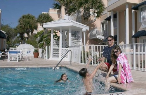 Chandler Park Condo | Steps to the sand in popular Royal Mansions complex. Southern facing patio unit!