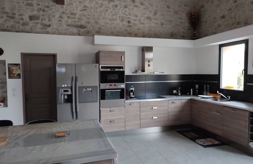Fontanes House | Stone house renovated in a contemporary style with garden and swimming pool.