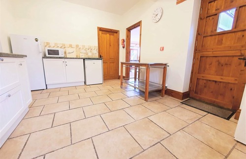 Woolland House | Stunning Barn Conversion with Exclusive Bar, Pool, Hot Tub & Countryside Charm