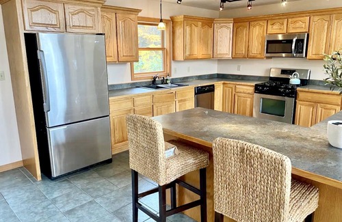 Town of Macomb Cabin | Stunning lake cabin 8 acres of woods, private boat dock, AC, WiFi & dog-friendly