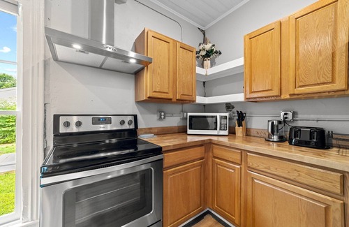 Graham House | Stylish downtown home: private hot tub, outdoor pizza oven & bumper pool table