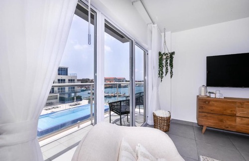 Oranjestad Apartment | Stylish luxury condo, central location, ocean view, pool