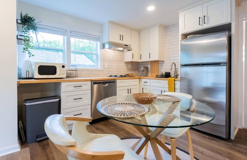 Sunset Road Cottage | Stylish renovated cozy cottage studio in quiet neighborhood 10 minutes to Uptown