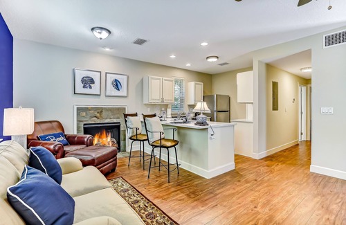 American Beach Condo | Stylish & sun-filled retreat with large patio & fireplace - near beaches & golf