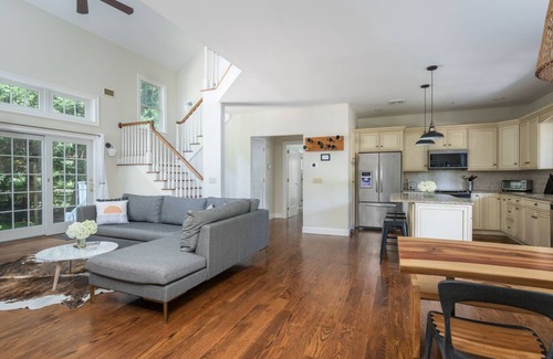 Town of Southold Town House | Sunlit and spacious 4/4.5 home with fireplace close to wineries and beaches.