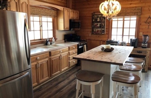 Amery Cabin | Sunset Cottage on Lake Wapogasset, Amery WI with Bunk Room, Hot Tub, AC, & more