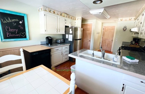 Suttons Bay House | Suttons Bay farmhouse-style home. 5 bedrooms. Air conditioning. Pet okay